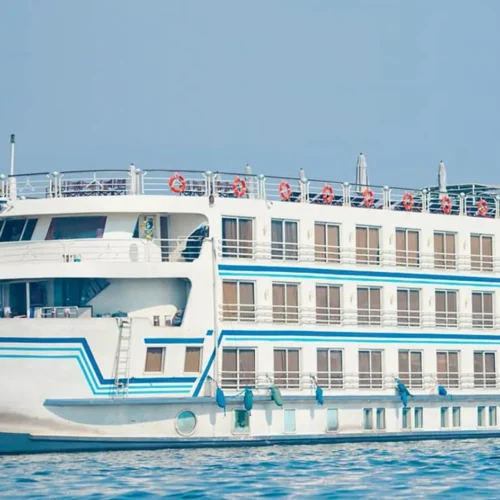 modern five star nile cruise ship moored along the scenic nile river bank in aswan under clear sky
