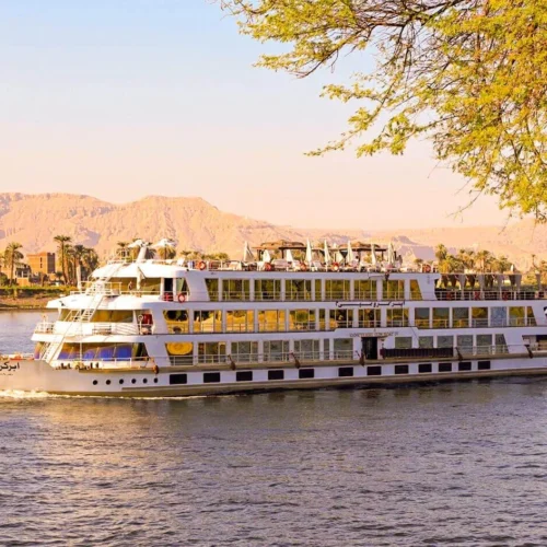 elegant luxury nile river cruise vessel gliding smoothly on blue nile waters during a seven night voyage
