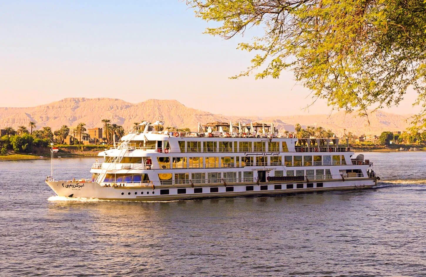 elegant luxury nile river cruise vessel gliding smoothly on blue nile waters during a seven night voyage