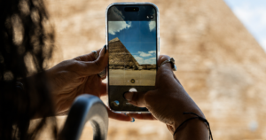 Tourist taking photo during Giza Pyramids golf cart tour