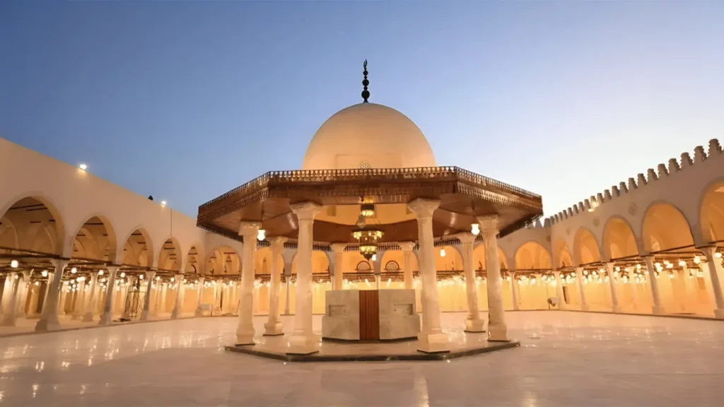 Courtyard of the Mosque of Amr Ibn Al-As with the ablution dome lit at dusk