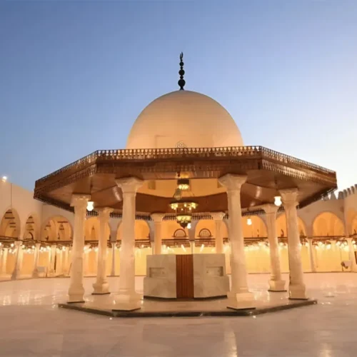 Courtyard of the Mosque of Amr Ibn Al-As with the ablution dome lit at dusk