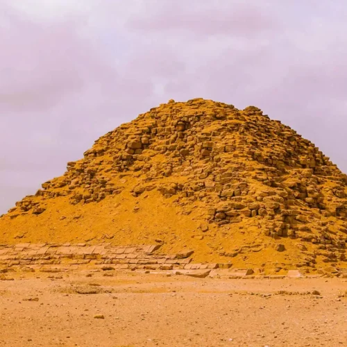 Eroded mound of an ancient pyramid rising from the desert at Dahshur
