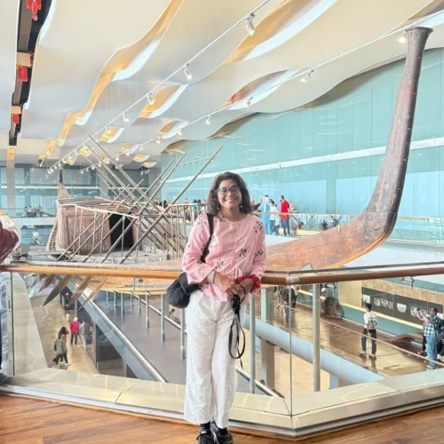 Traveler in the Khufu Solar Boat hall at the Grand Egyptian Museum