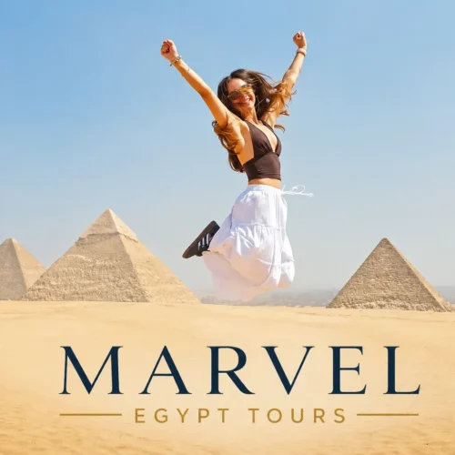 Traveler jumping for joy in front of the Giza pyramids