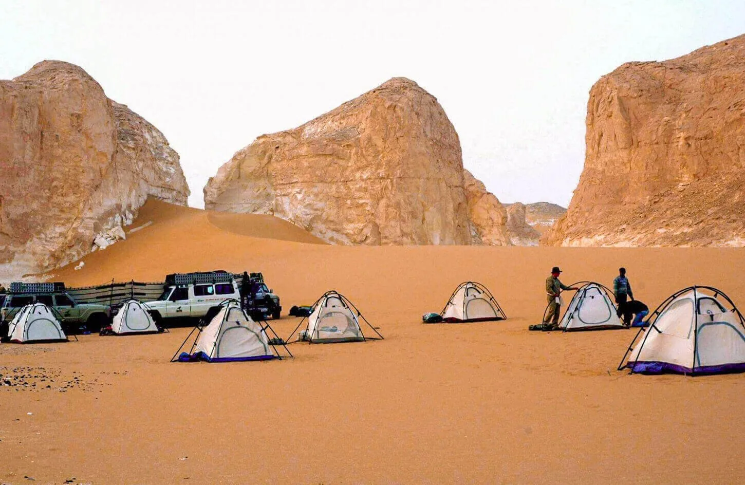 4x4 safari jeep driving across golden sand dunes in the hurghada red sea desert during a sunset safari