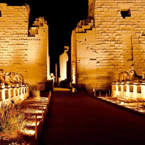 dramatic evening lighting on the avenue of sphinxes at karnak temple during the sound and light show