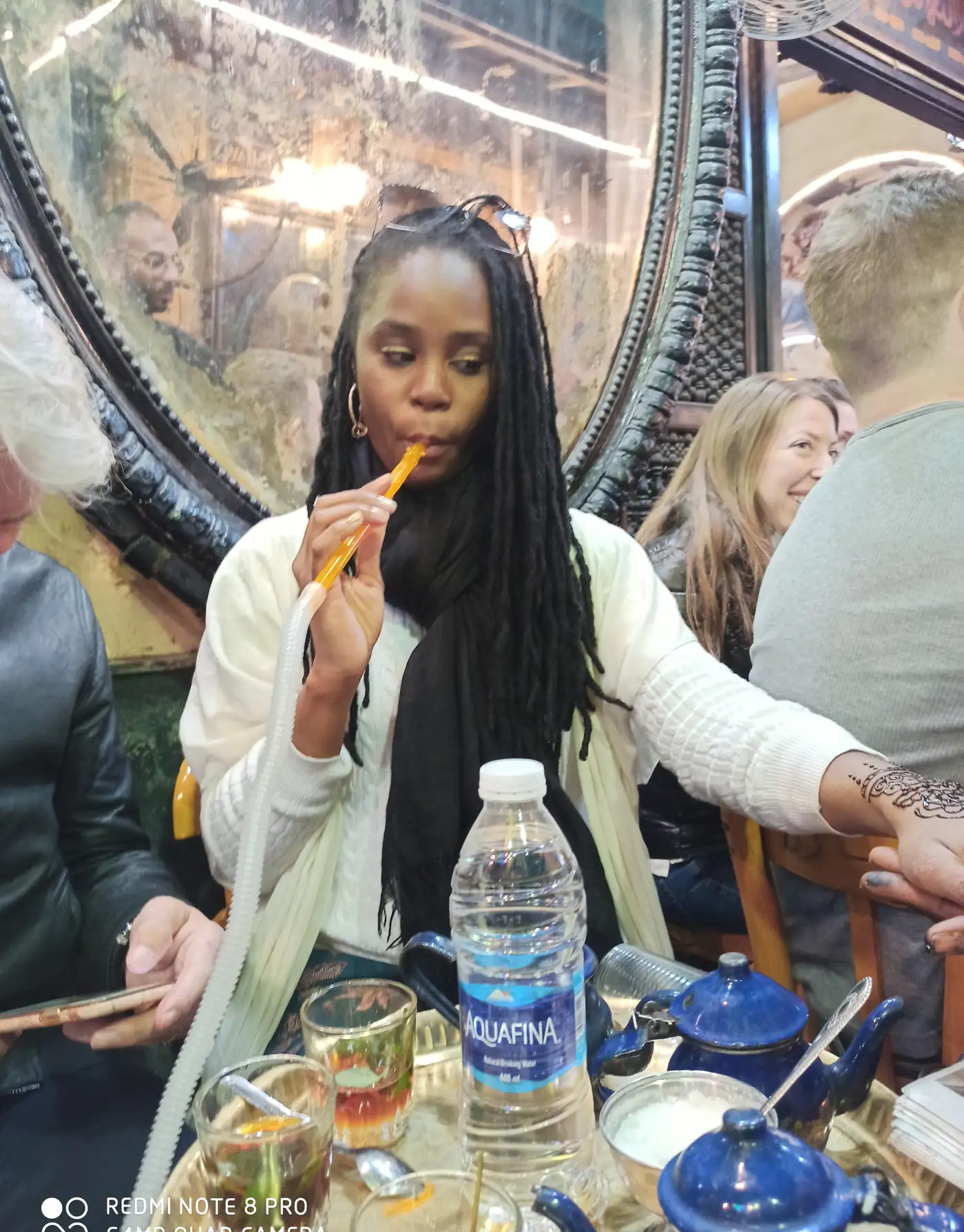Traveler with mint tea and henna at a traditional café in Khan El Khalili