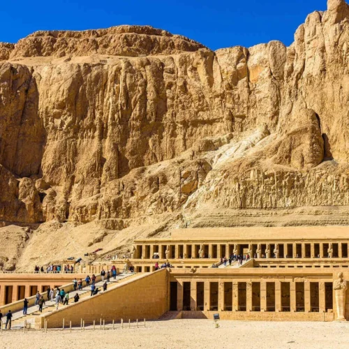 grand limestone colonnade facade of queen hatshepsut temple at the foot of the deir el-bahari cliffs