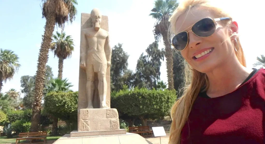 Selfie beside the standing Ramses II statue in the garden of the Memphis museum