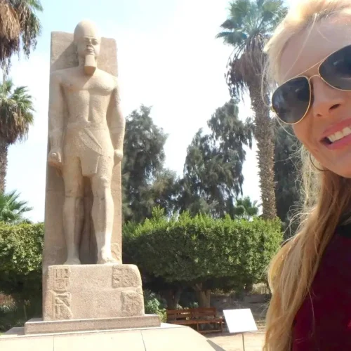 Selfie beside the standing Ramses II statue in the garden of the Memphis museum