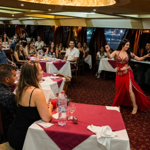 Belly dancer performing for Travelers during a Nile dinner cruise show