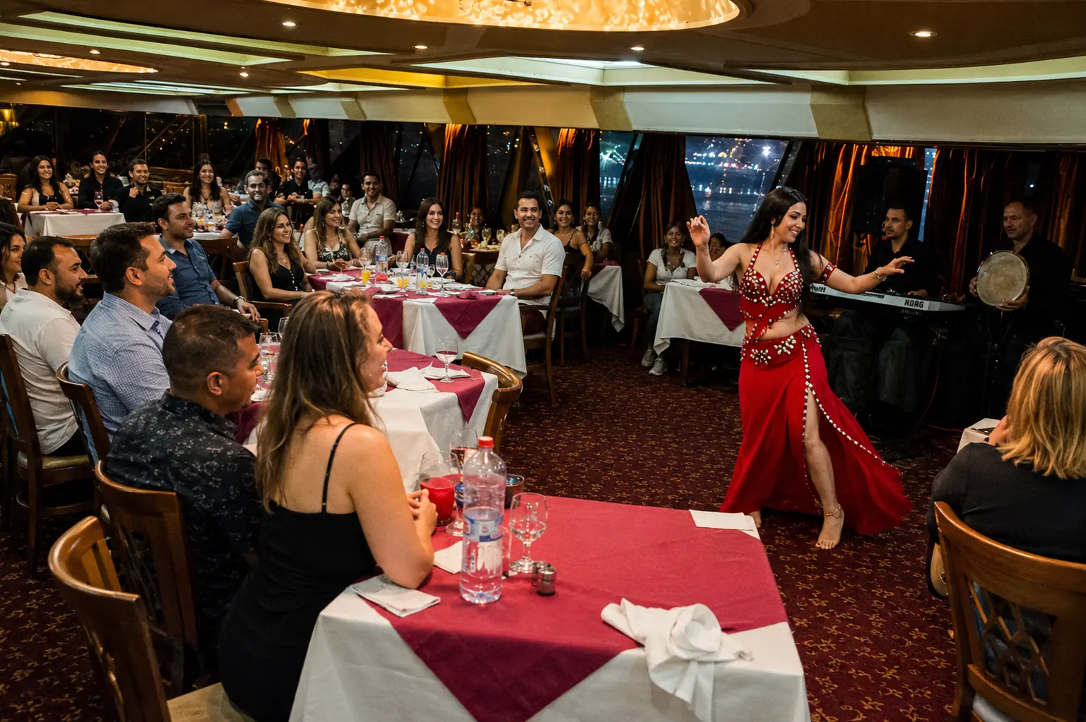 Belly dancer performing for Travelers during a Nile dinner cruise show