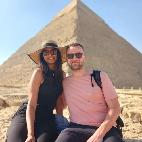Couple seated in front of the Pyramid of Khafre at Giza