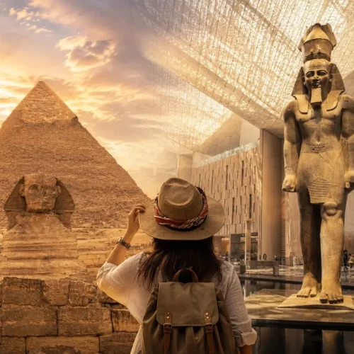 Traveler viewing the Khafre pyramid and Sphinx beside the colossal Ramses II statue at the Grand Egyptian Museum