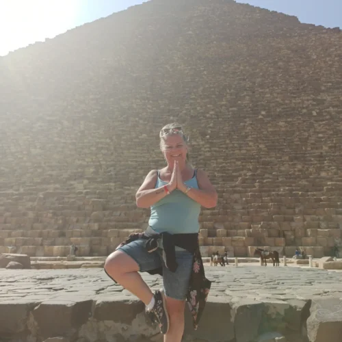 Traveler in front of the casing stones of a Giza pyramid