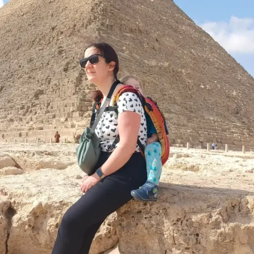 Traveler seated in front of the Pyramid of Khafre at Giza