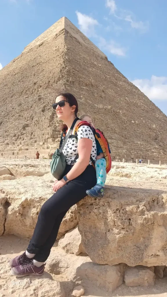 Traveler seated in front of the Pyramid of Khafre at Giza