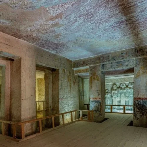 Painted reliefs and statues inside a mastaba tomb at Saqqara