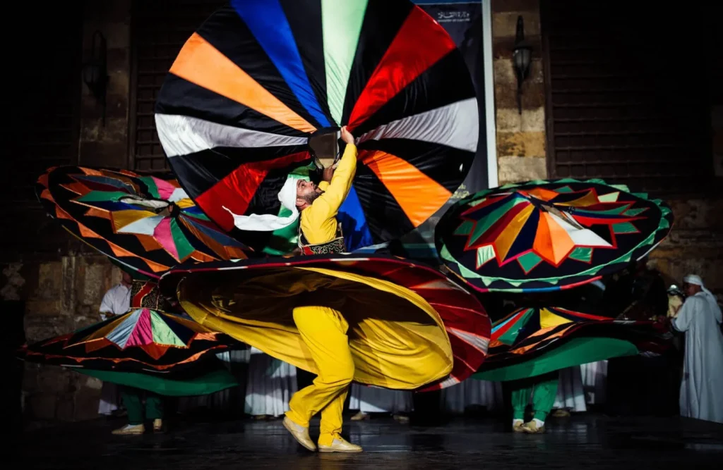 A Tanoura dancer in a wide spinning skirt.