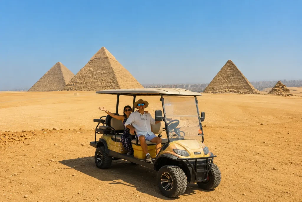 Couple in a private golf cart with all the Giza pyramids behind them