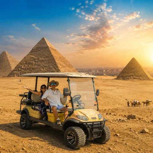Couple riding a private golf cart at the Giza pyramids at sunset, camels in the distance