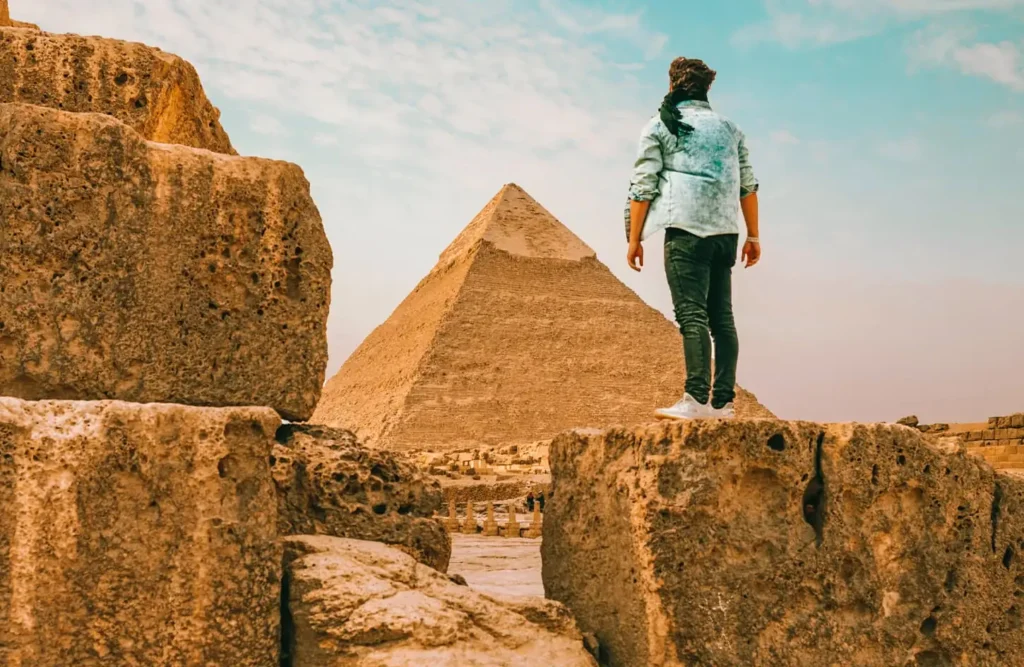 Traveler standing in front of the Pyramid of Khafre at Giza