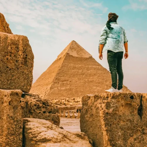 Traveler standing in front of the Pyramid of Khafre at Giza