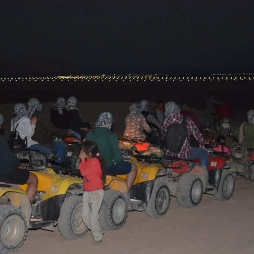 A group of quad bikers in safari dessert
