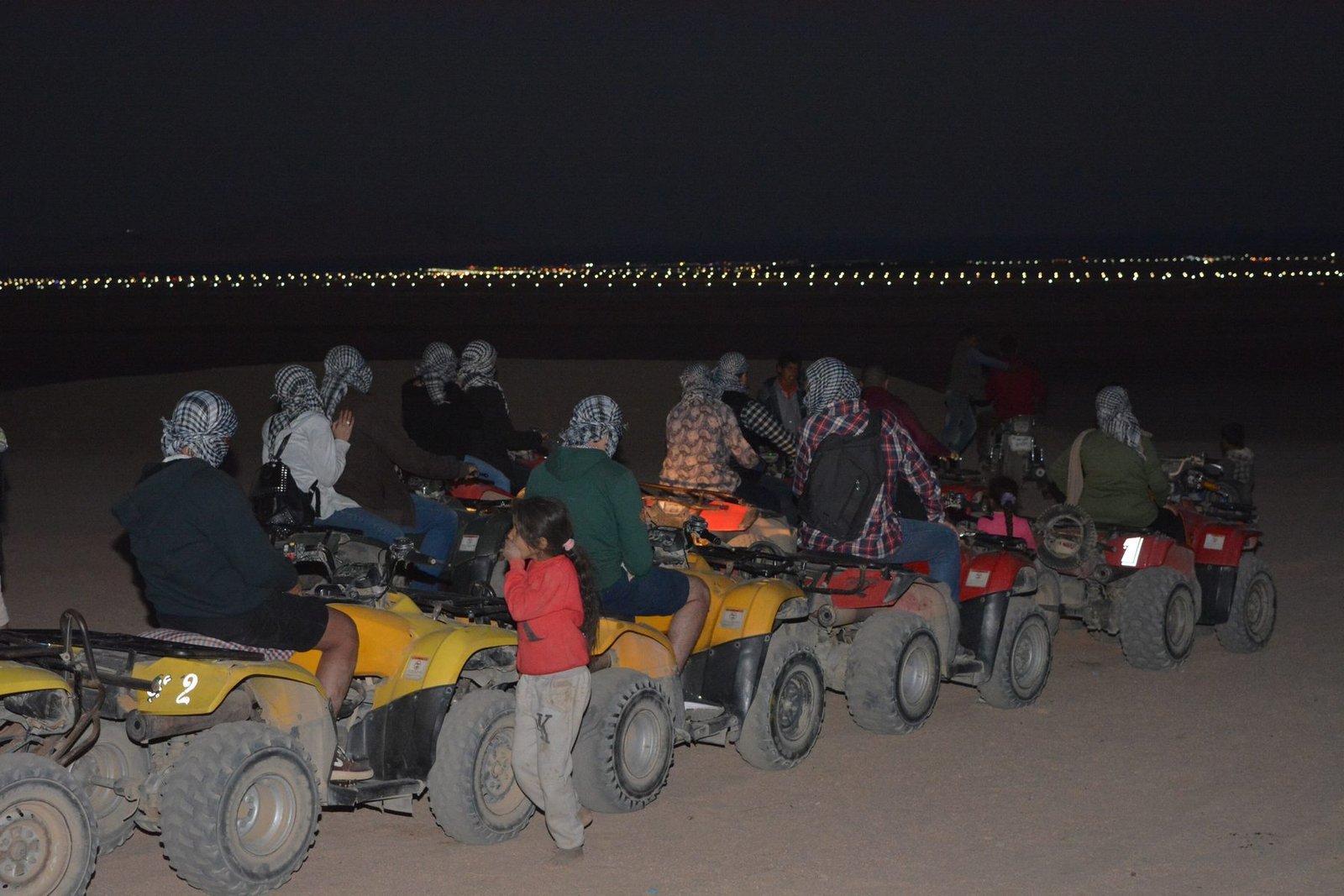 A group of quad bikers in safari dessert