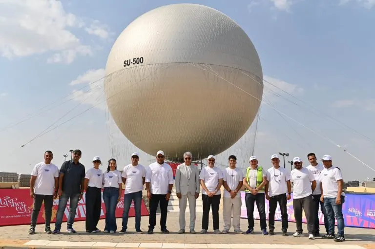Ground team standing in front of the large SU-500 tethered balloon sphere